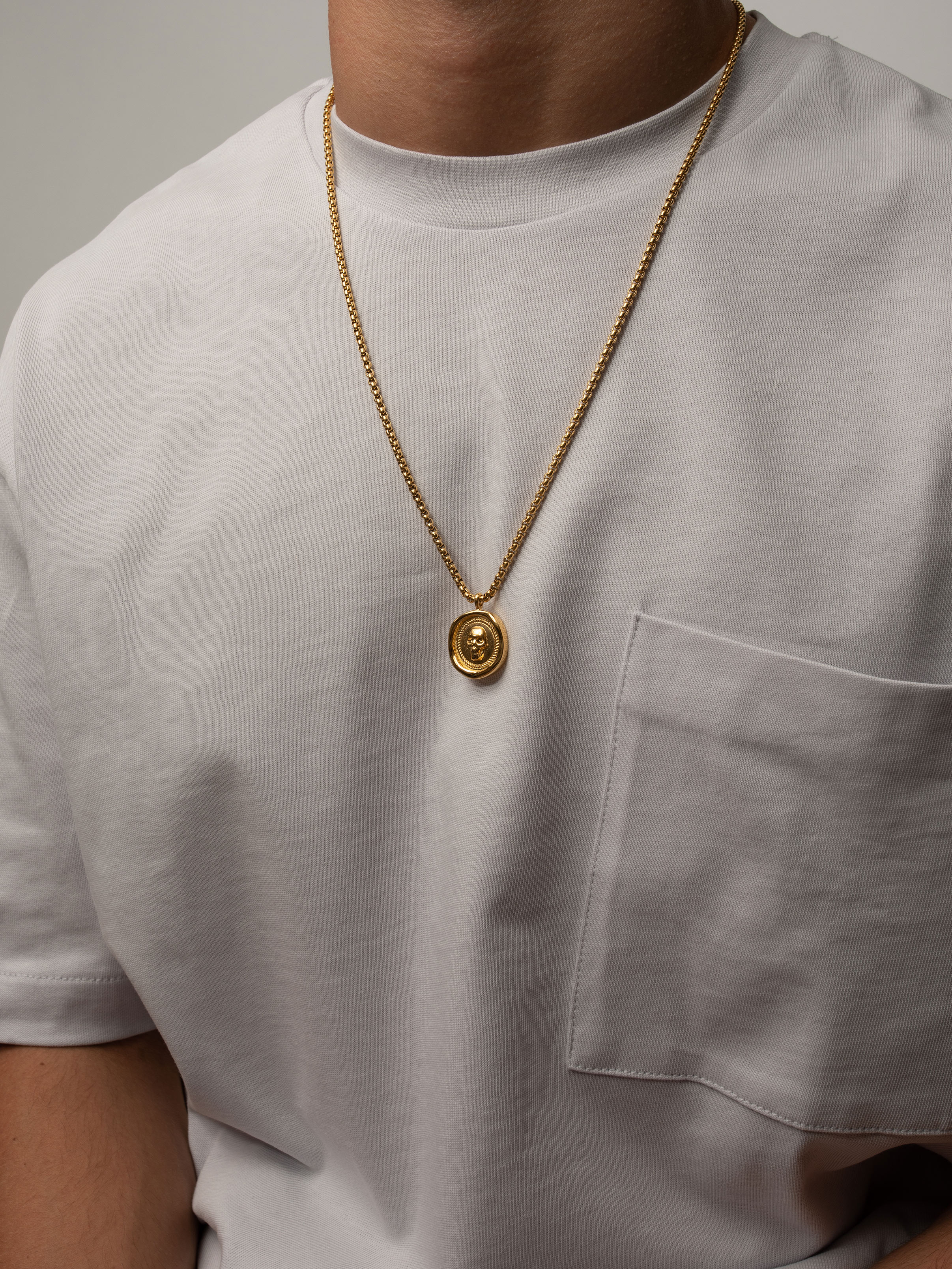 men wearing gold chain